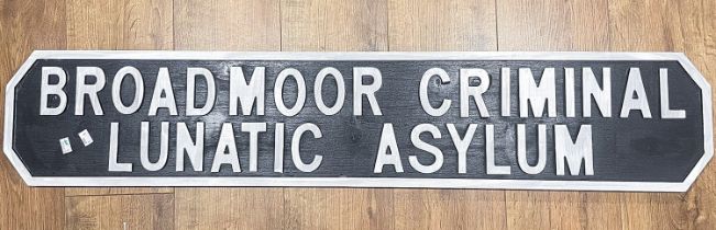 A Modern painted wood reproduction sign which reads: 'Broadmoor Criminal Lunatic Assylum', approx