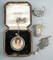 A 19th century foliate pendant, set with paste stones and a pearl drop, silver settings on yellow