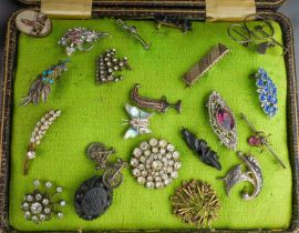 A collection of 19th and 20th century jewellery, including cut steel buckles, paste-set buckles, Art