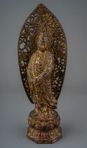 Chinese bronze figure of Guan Yin, red pigment and gilding. Impressed seal mark to the base, approx.