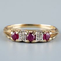 A 9ct yellow gold ruby and diamond ring, set with three round-cut rubies with diamond-chip