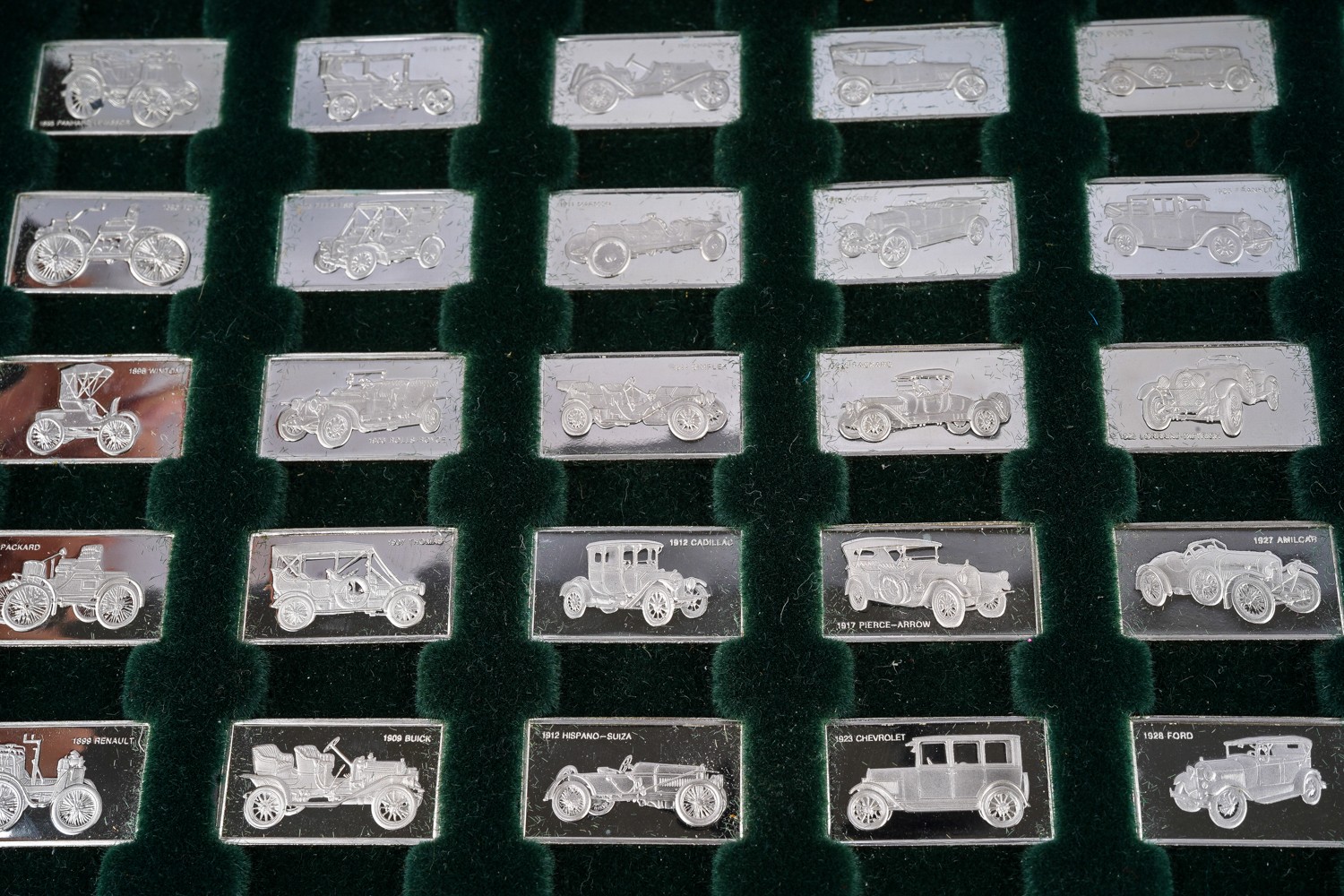 A cased set of John Pinches silver ingots, 'The 100 Greatest Cars' silver miniature collection in - Image 4 of 4