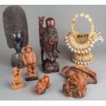 Assorted carved African Tribal tourist wares mainly masks and figures together with Continental