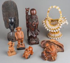 Assorted carved African Tribal tourist wares mainly masks and figures together with Continental