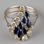 A 14k white gold diamond and sapphire dress ring, set with round brilliant-cut diamonds and marquise