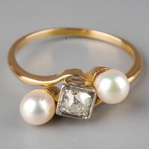 A yellow gold diamond and pearl three-stone ring, set with an old-cut diamond in a square mount,