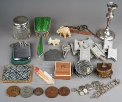 A silver-filled candlestick; a silver topped dressing table jar; a silver lid; a military button