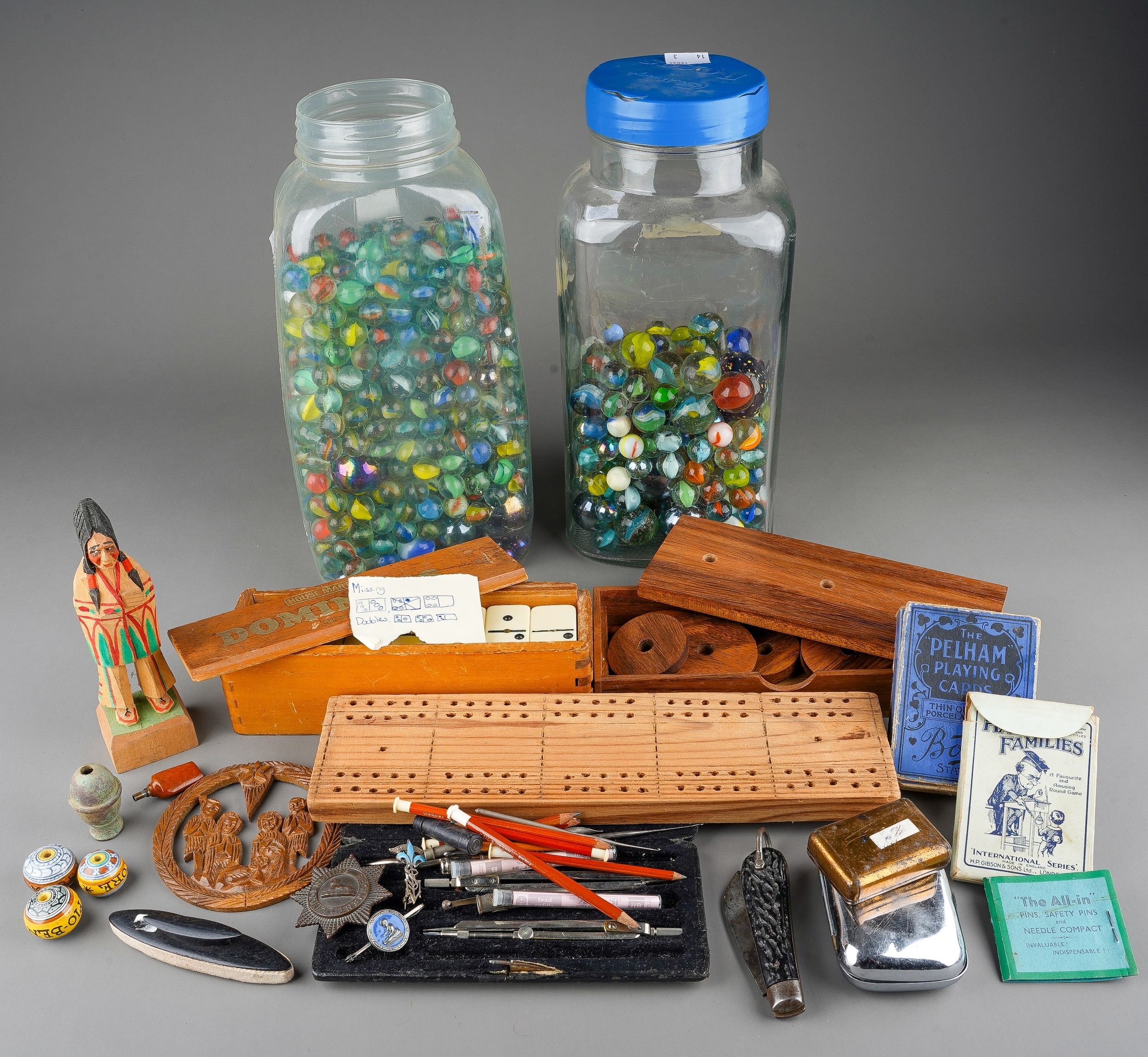 A large collection of assorted marbles in various sizes together with vintage Dominos, playing cards