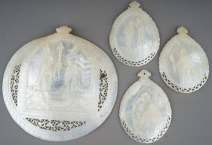 Four antique carved Mother of Pearl shell icons/baptismal shells. Loss to the larger one