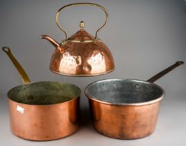 A late 19th Century large copper kettle together two two large copper pans, one stamped 24 wear