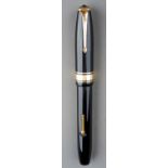 A vintage Conway Stewart 100 black and gilt fountain pen with 14ct gold nib, stamped Duro Conway