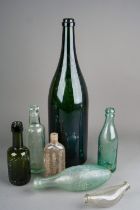 A collection of vintage cob bottles, further bottles, a Scheppes soda stream and a large green