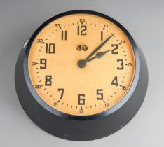 An early 20th Century English bakelite cased Garrard wall clock with hinge bracket, untested