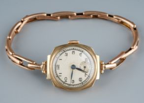 A 9ct yellow gold wristwatch, circular dial with Arabic numerals, expanding strap, total gross