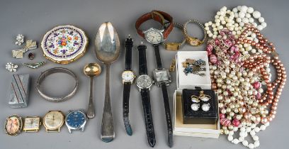 A collection of costume jewellery, including a silver bangle, beads, necklaces, brooches,