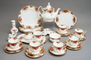 Royal Albert Country Roses tea and dinner wares to include tea pot, dinner plates, trios, cake