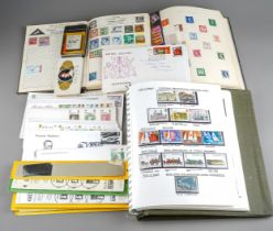 A collection of stamps in three albums with a good set of 1960's - 70's mint GB including pairs.