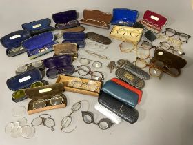 A collection of various vintage spectacles and glasses, some gold