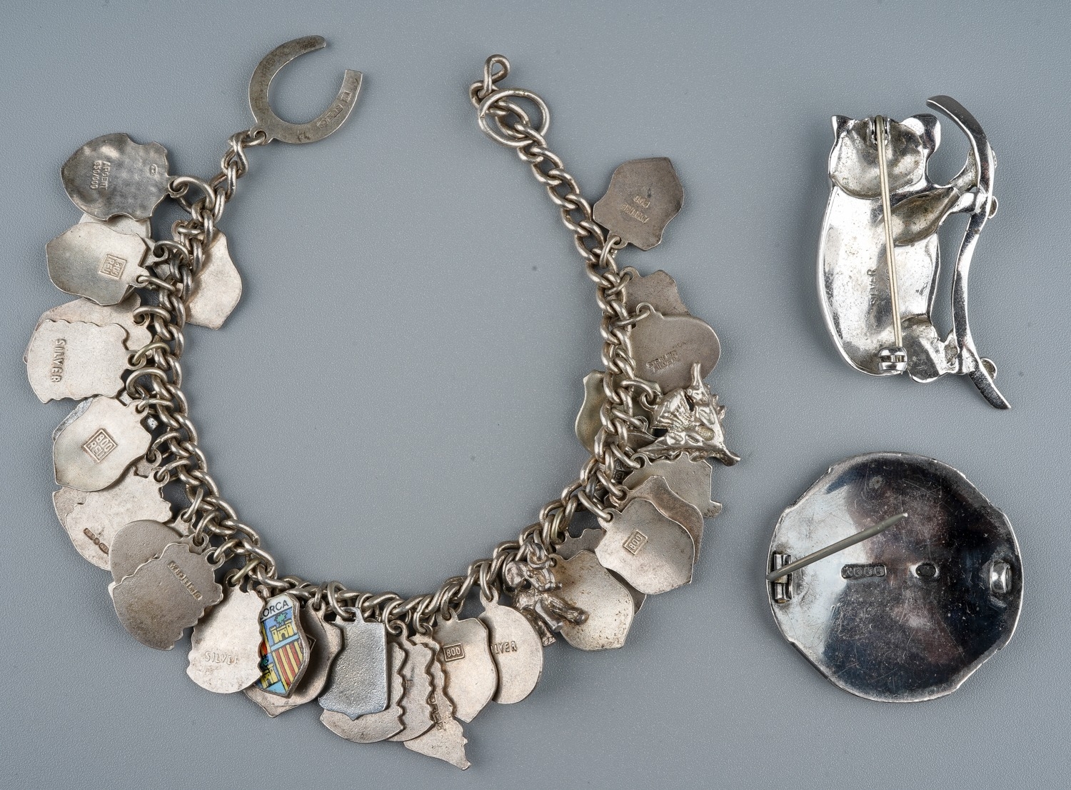 A silver charm bracelet, with enamelled souvenir charms; a Scottish silver brooch, makers mark RA, - Image 2 of 5