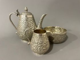 Late 19th century Indian Kutch silver three-piece tea set. The tea pot and jug have handles in the