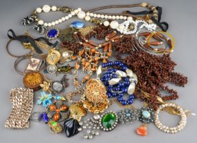 A quantity of costume jewellery, including brooches, beads, earrings, necklaces, bangles, etc,