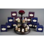 A collection of thirteen Royal Crown Derby thimbles, in numbered boxed and stand (1 bag)