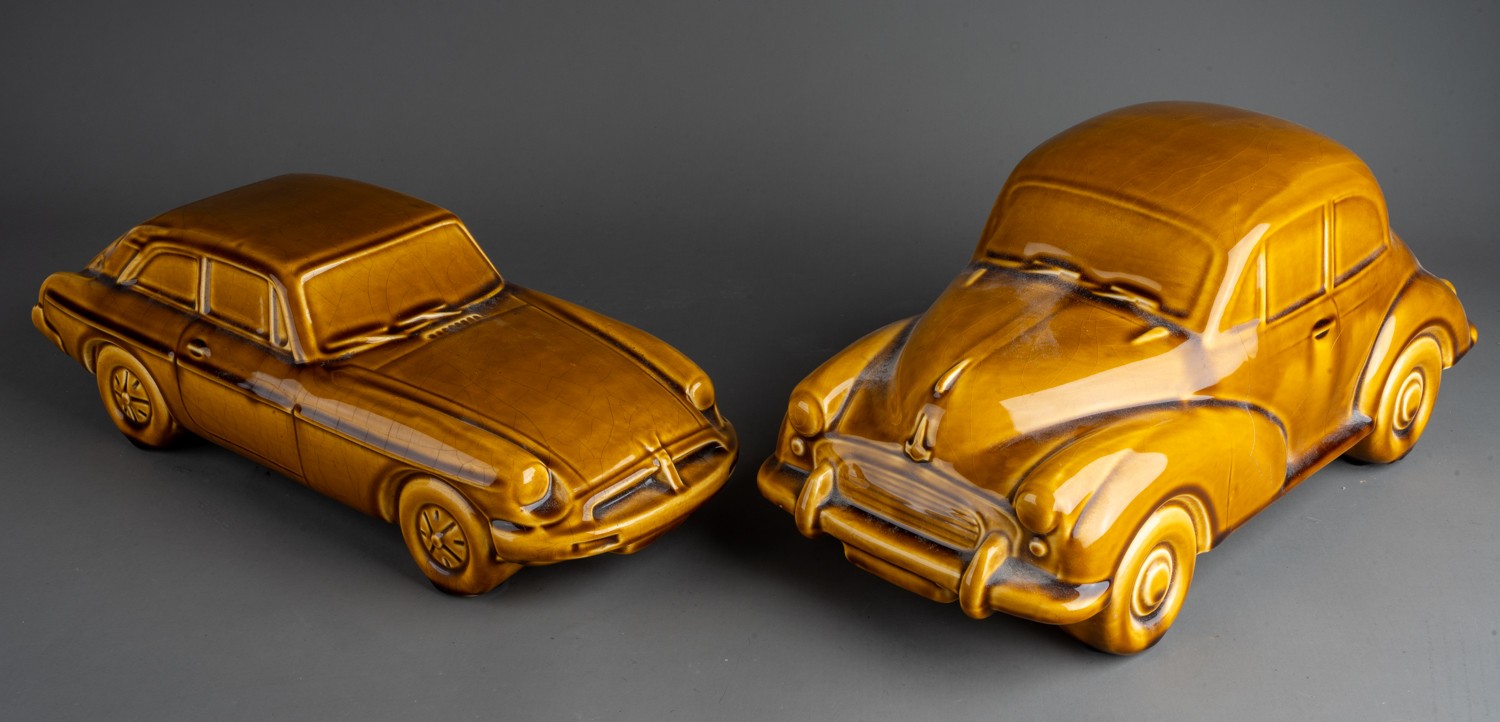 Two large Dartmouth style mustard models of cars to include a MG and Morris Minor 1000 (both with