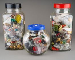 A collection of miscellaneous vintage buttons, various sizes and mediums, in three large glass sweet