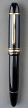 A large Montblanc Meisterstuck no. 149 black fountain pen with gilt fittings, the 14K gold nib