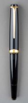 A vintage Montblanc Meisterstuck no 12 black fountain pen with gilt fittings, yellow metal nib (