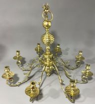 A very large Dutch style eight branch heavy gage brass chandelier, all arms detached (1)