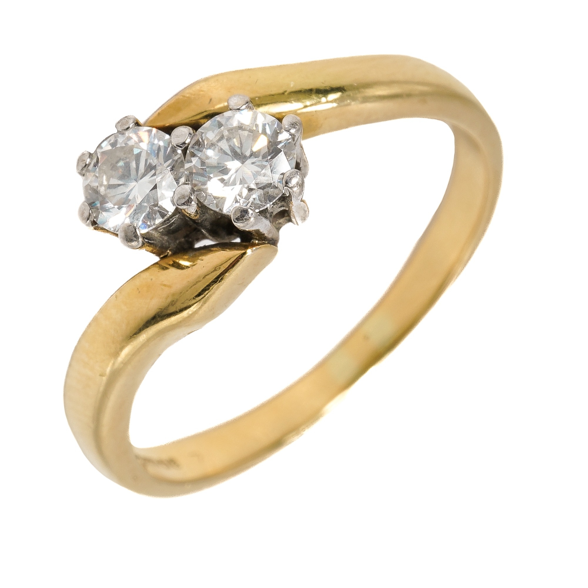 An 18ct yellow gold and diamond two stone crossover ring, set with round brilliant cut diamonds,