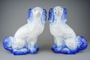 A pair of Staffordshire blue Spaniels, stamped WOOD to bases together with two early 20th Century