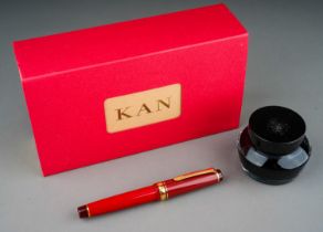 A Japanese Sailor red and gilt fountain pen with 21k Naginata Togi nib, stamped 21K 875, boxed