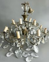 An Italian style gilt brass twelve light chandelier with drops