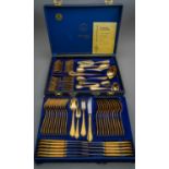 A cased Solingen 23/24 carat gold plated ornate eleven piece (place setting) canteen of cutlery /