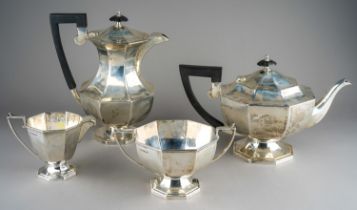 A George VI silver four piece tea service comprising teapot, milk jug, sugar bowl and hot water pot,