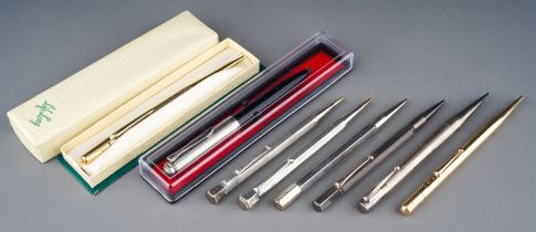 Five early 20th Century Sterling silver pencil holders, various makers together with a Fyne Todd