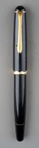 A Montblanc Monte Rosa black fountain pen with gilt fittings, the 14c gold nib stamped MONTE ROSA