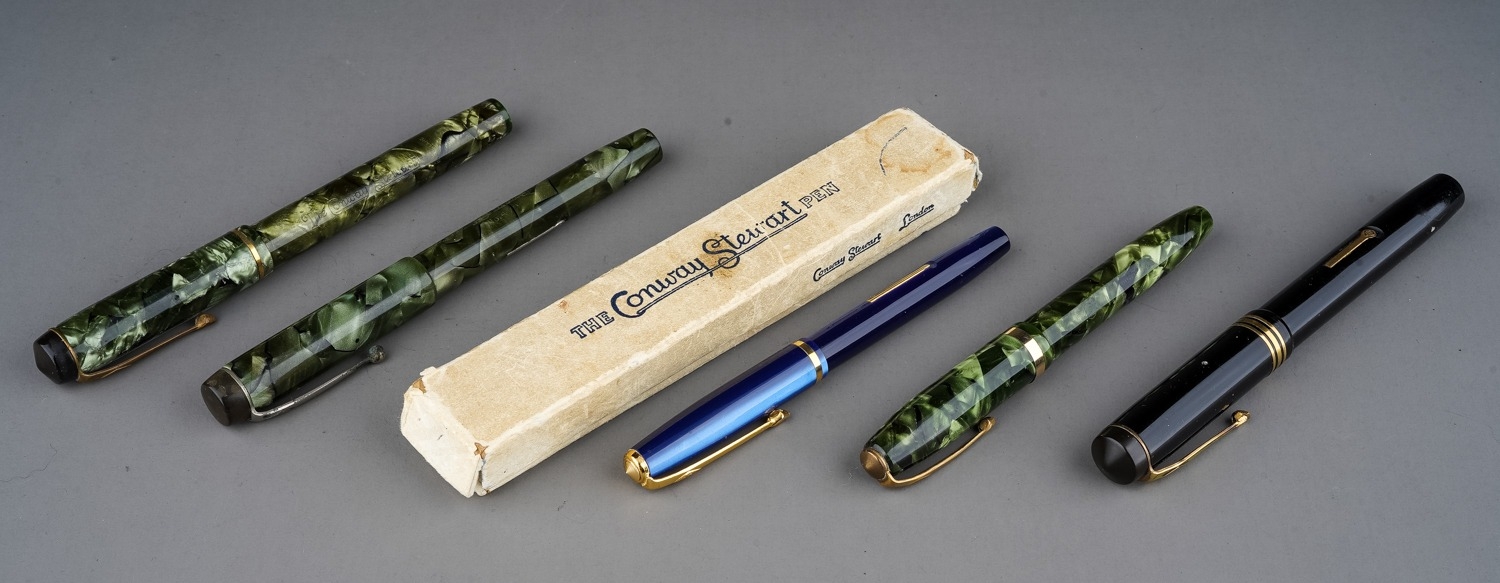 A collection of five early 20th Century Conway Stewart fountain pens to include: boxed blue and