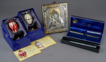 Two Russian style enameled decorative eggs in boxes, Russian style icon with Hallmarked silver