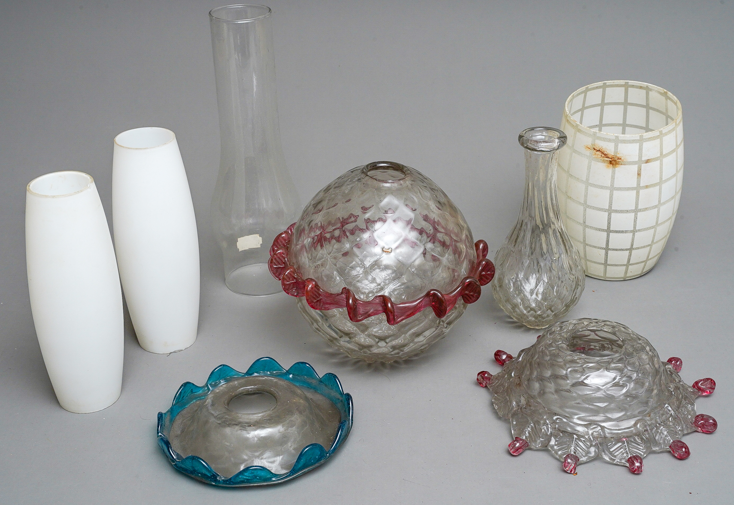 A large collection of assorted glass to include condiment jars, chandelier / oil lamp parts, glass