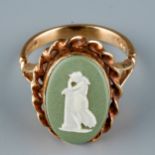 A 9ct yellow gold and Wedgwood jasperware cameo ring, set with an oval green and white jasperware