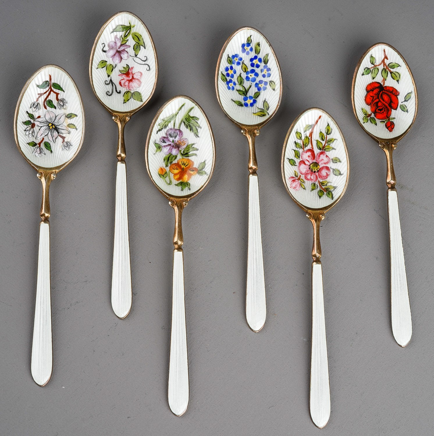 A set of six Modern silver gilt and enamel teaspoons, the bowls decorated with flowers, roses, - Image 2 of 4