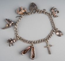 A silver charm bracelet; another silver charm bracelet with lose charms; and a bonded gold bracelet,