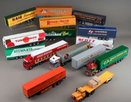 Two boxes of diecast articulated trailers, some code 3 plus tractor units (2)