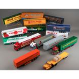 Two boxes of diecast articulated trailers, some code 3 plus tractor units (2)