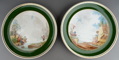 A pair of Minton wall plaques transfer printed with Continental fishing scenes, approx 32cm diam (2)