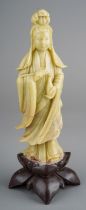 An early 20th Century Chinese carved soapstone figure of lady on lotus flower base, approx 20cm high