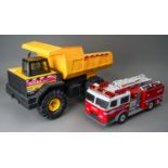 Tonka Toys. A Mighty dump truck. Mighty 768 transfer with a plastic bodied fire engine. Large